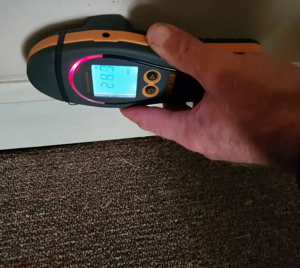 Moisture detection at baseboard during Storm Damage Restoration in Lower Allen